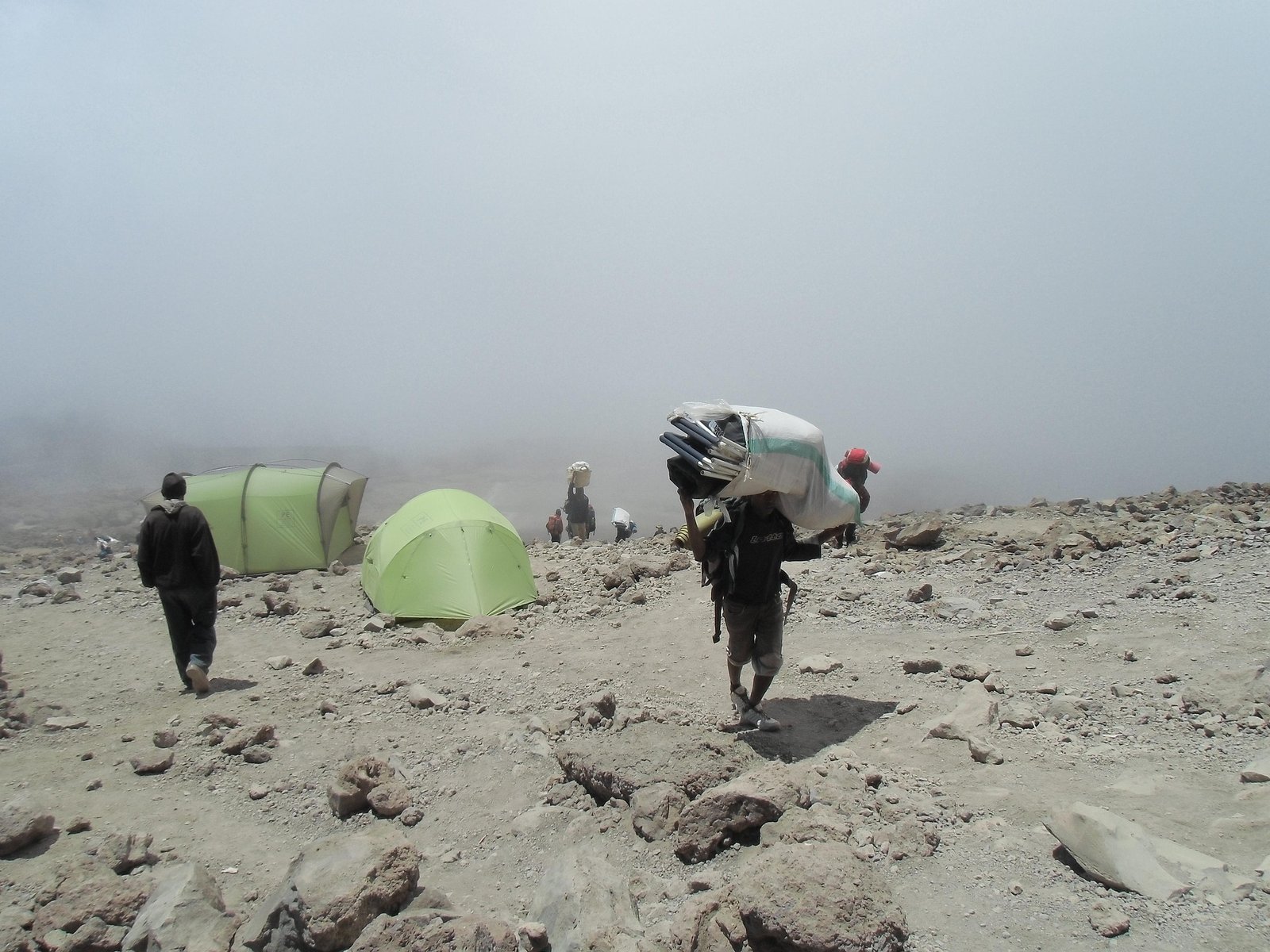 Hikers approaching Uhuru Peak on Mount Kilimanjaro Tanzania