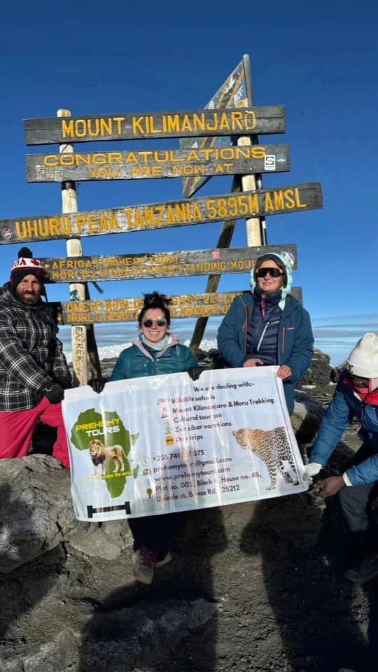 T Kilimanjaro trekking with guides, Prehemy Tours Lemosho route, summit photo with team, Kilimanjaro crew camping setup